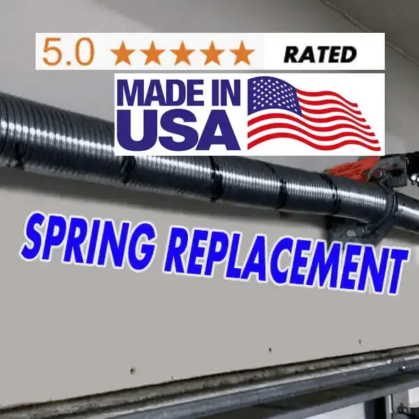 Technician replacing a broken torsion spring on a garage door in Hayward and Castro Valley CA