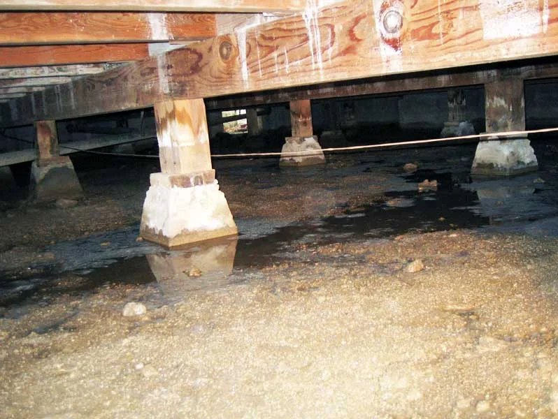 Standing water removed during crawl space cleanup in a Tarzana home