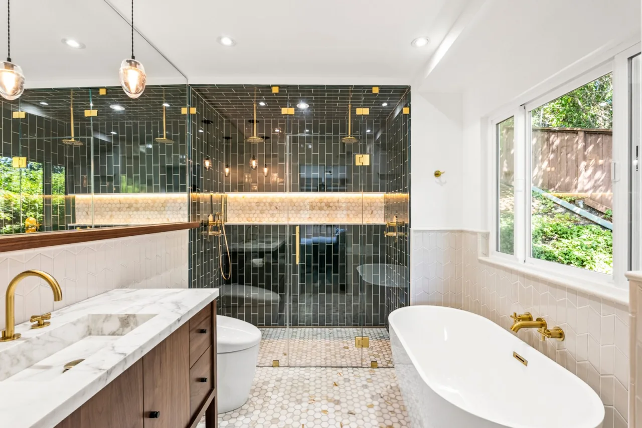 Master bathroom remodel in Orinda CA with green tile and brass fixtures by Bay Home Remodeling