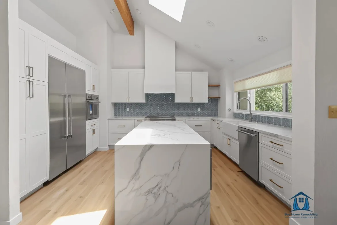 White kitchen remodel in Walnut Creek CA with marble island by Bay Home Remodeling