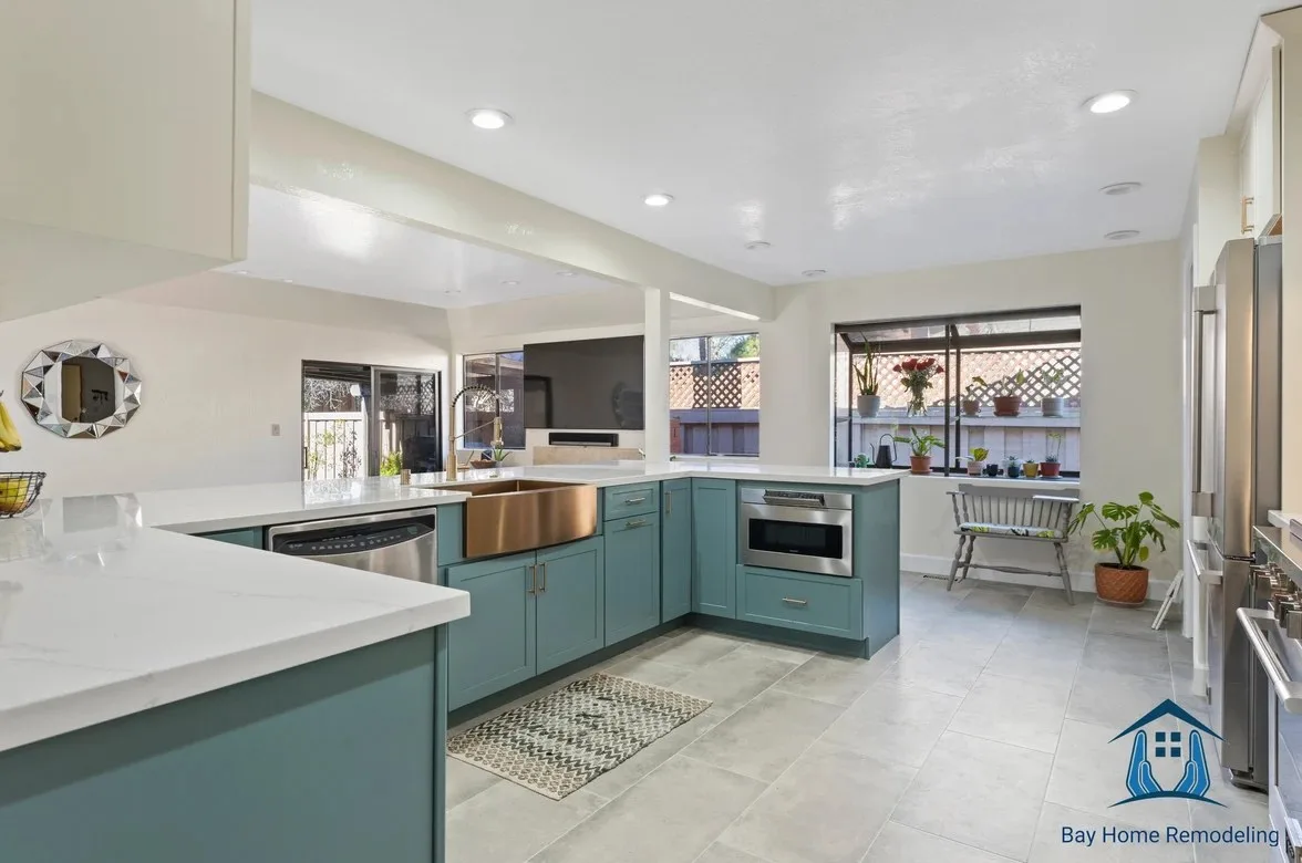 Kitchen remodel in Oakland CA with teal cabinets and waterfall countertop
